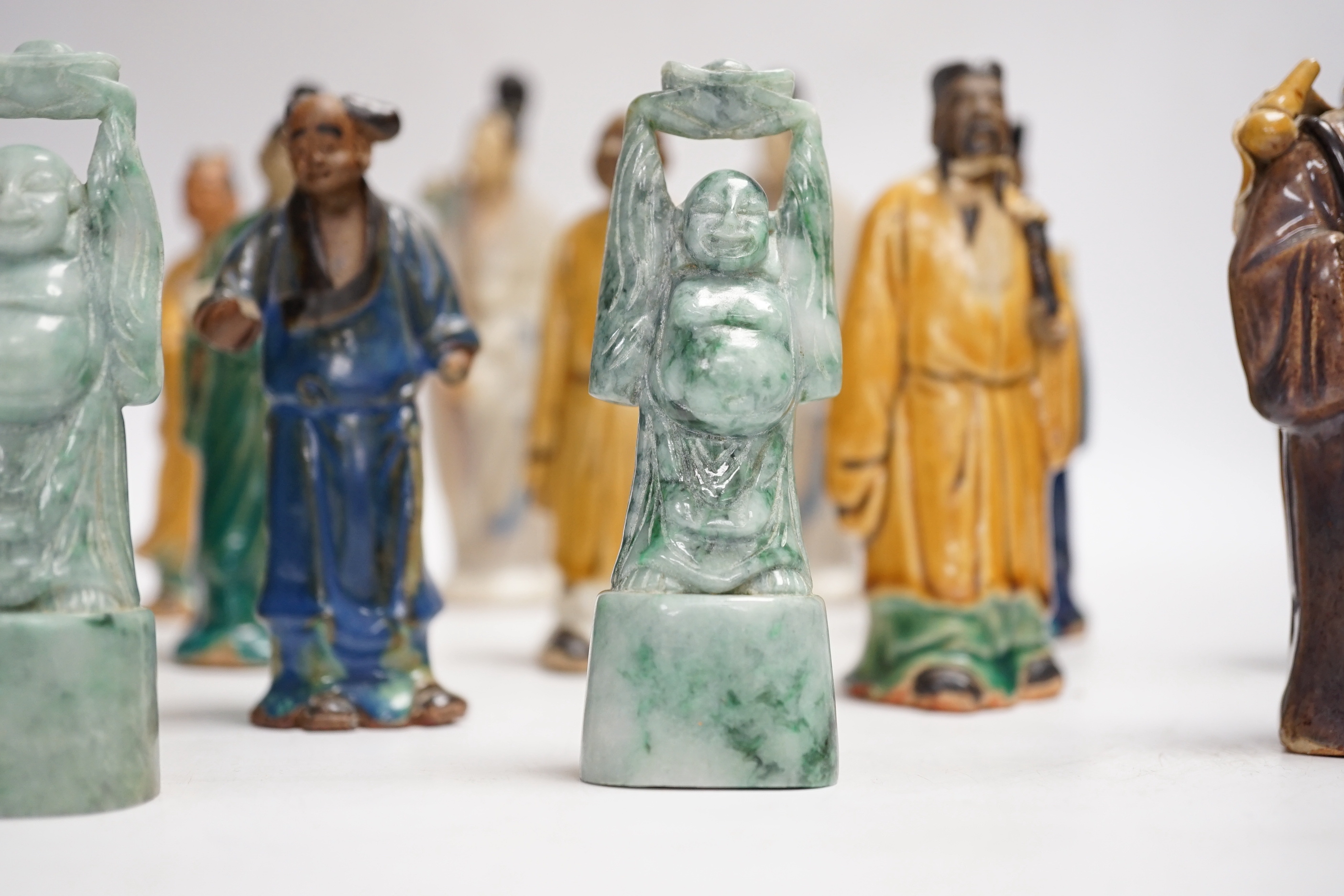 Fifteen Chinese Shiwan-type glazed pottery figures and carved stone figures, early 20th century, tallest 15cm